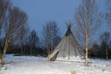 teepee in the snow background © Andrea Izzotti