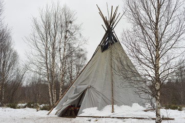 teepee in the snow background © Andrea Izzotti