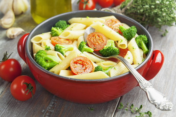 Penne pasta with broccoli and cherry tomatoes