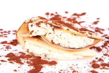 Pancake with cottage cheese (mixed with yolk & brown sugar) decorated with cocoa