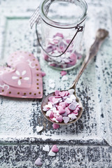 Valentine's cake decorations on a spoon