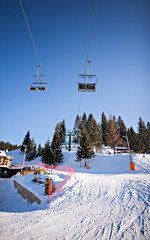 winter ski lift chair at snowy landscape