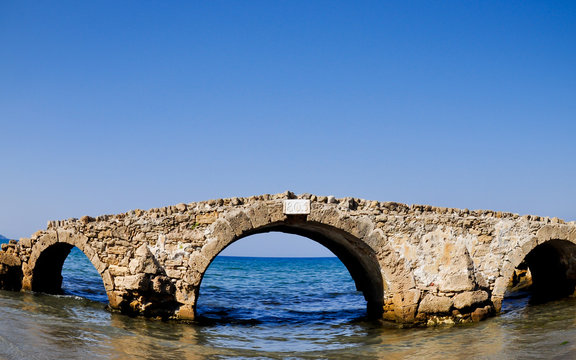 Ruined bridge in the sea. Zakynthos. Greece