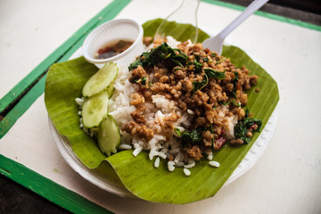 Thai rice meal on banana leaf at Ampahwa floating market