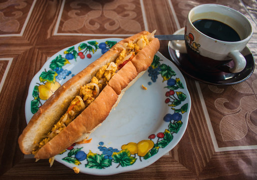 Baguette with eggs and black coffee in Laos