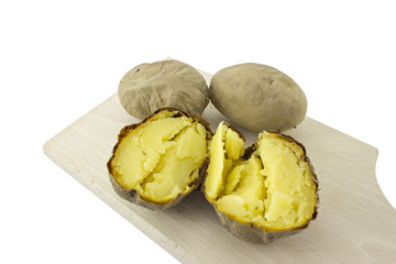 potatoes from the oven, baked potatoes on cutting board