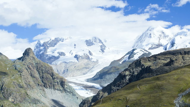Time lapse panning motion cloudscape Alpine glacier, Europe