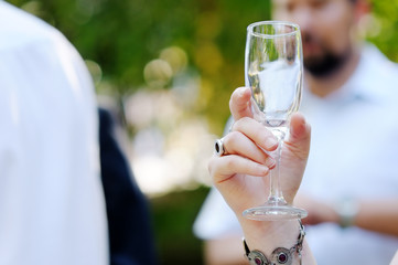 Champagne glass in woman's hand