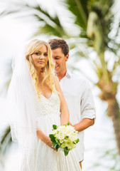 Married couple, bride and groom getting married, Tropical weddin