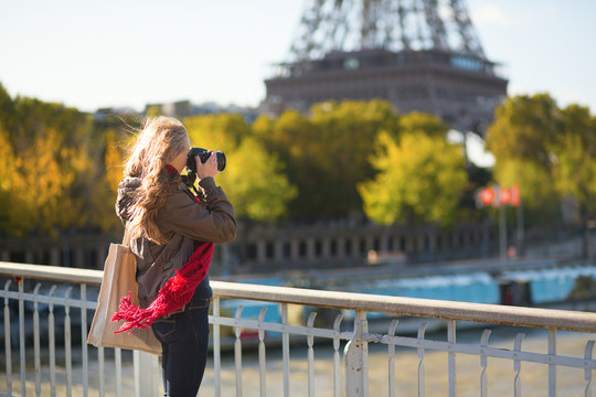 Tourist taking picture of the Eiffel tower