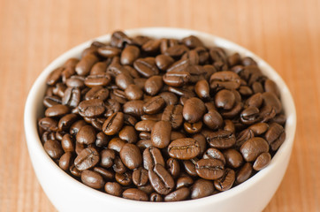 Coffee bean in white cup