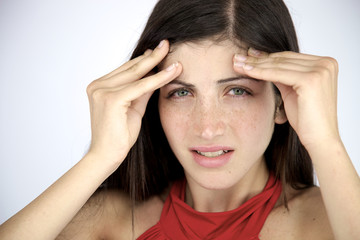 Woman suffering strong migraine in the morning with no makeup