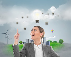 Ecology ideas concept. Businesswoman standing in front of citysc