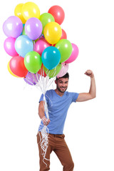 happy casual man winning a big bunch of balloons