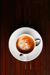 Coffee cup on wooden background