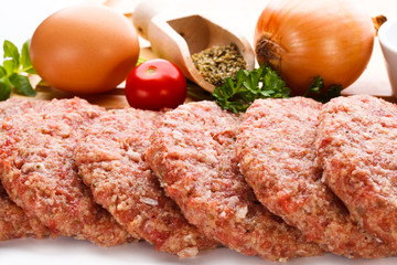 Raw minced pork chops meat on white background