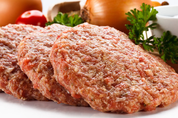 Raw minced pork chops meat on white background
