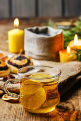 Cup of golden tea in evening candle light. Romantic atmosphere