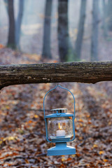 Beautiful lantern hanging on wooden fence