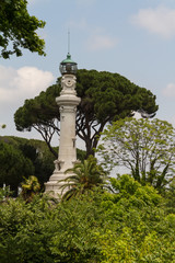 Fototapeta premium small lighthouse between the trees in Rome, Italy