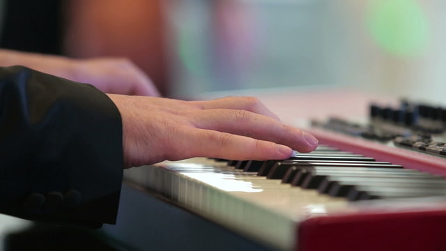 The musician plays keyboards