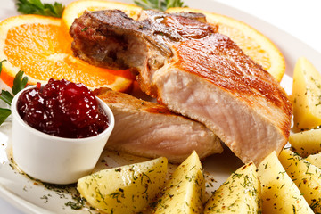 Grilled steak, boiled potatoes and lingonberry jam