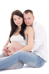 Fototapeta na wymiar young attractive pregnant woman and her husband sitting isolated