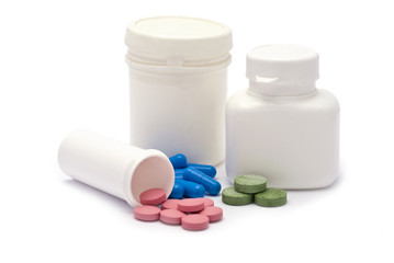 Pink, Blue and Green Drugs with Containers isolated on white