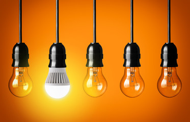 Eco concept with glowing LED bulb