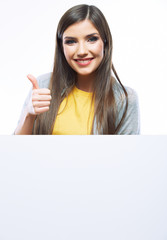 Fototapeta premium Teenager girl with white blank board. White background isolated