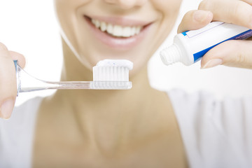 Closeup girl with toothbrush cleaning teeth at home, whiten toot