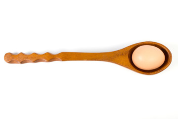 eggon on a wooden spoon.