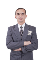 Young businessman in a suit and with dollars in his pocket.