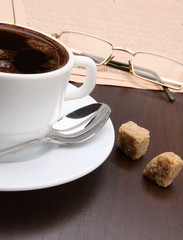 Cup of coffee and newspaper.