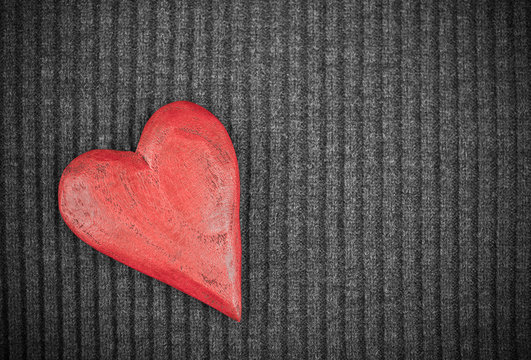 Red Wooden Heart on Knitted Background