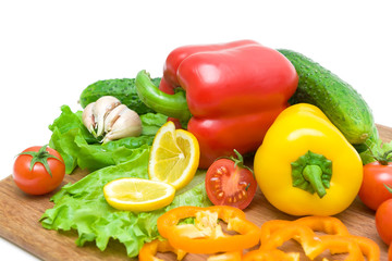 vegetables on a cutting board on a white background