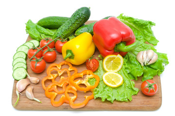 vegetables on a cutting board on a white background close-up.