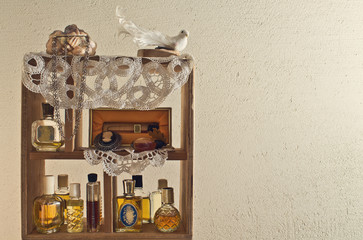shelf on the wall with women's perfume - 60209780