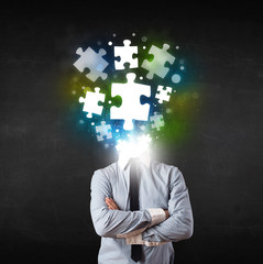 Character in suit with puzzle head concept