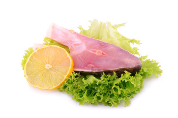 Piece of carp with lemon isolated on white