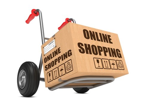 Online Shopping - Cardboard Box on Hand Truck.