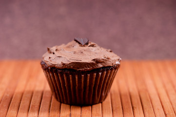 one isolated chocolate muffin with hazlenut dark chocolate cream