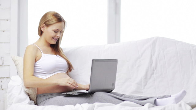 pregnant woman with laptop computer