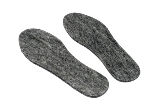 Felt insoles for shoes isolated on white background