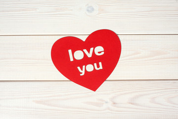 Heart symbol on a wood background