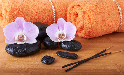 Obraz na płótnie Canvas spa stones, towels and orchid