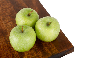 Fresh juicy water-sprinkled apples on white background