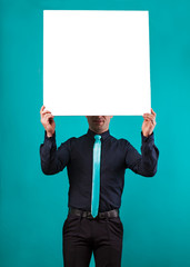 close up of man hands showing white blank board