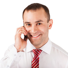 Closeup of happy young man using mobile phone