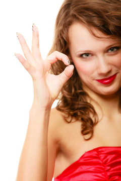 Happy smiling woman with showing ok sign gesture isolated